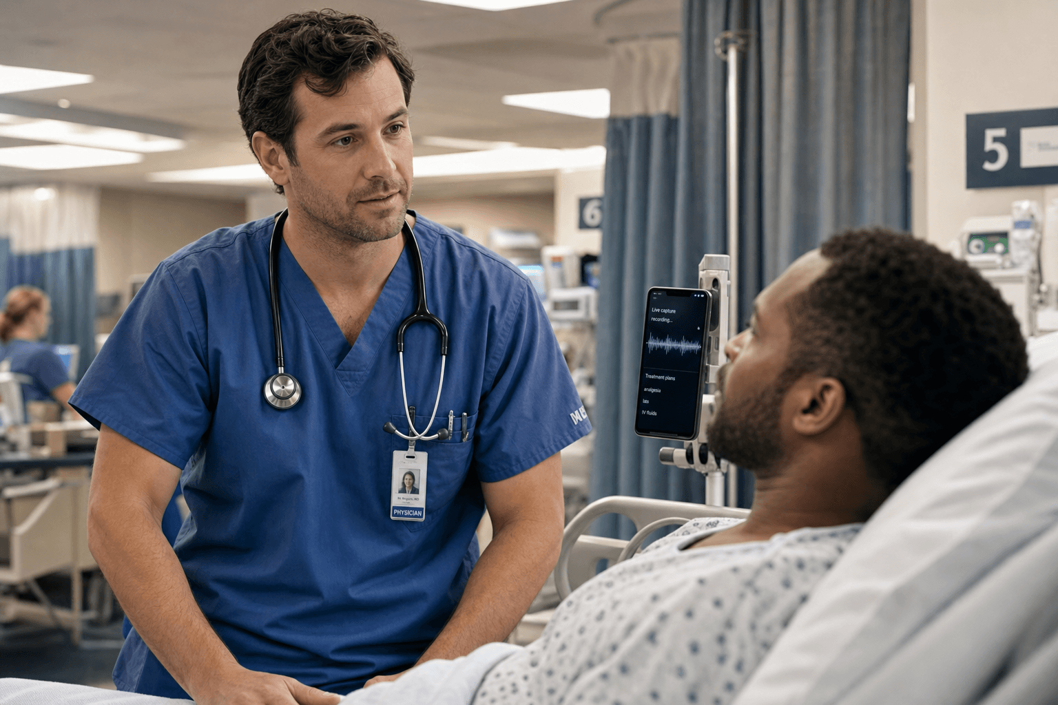 A physician in scrubs at a patient bedside in an emergency department bay, with a tablet displaying an audio waveform and partial clinical text suggesting ambient AI documentation in progress.