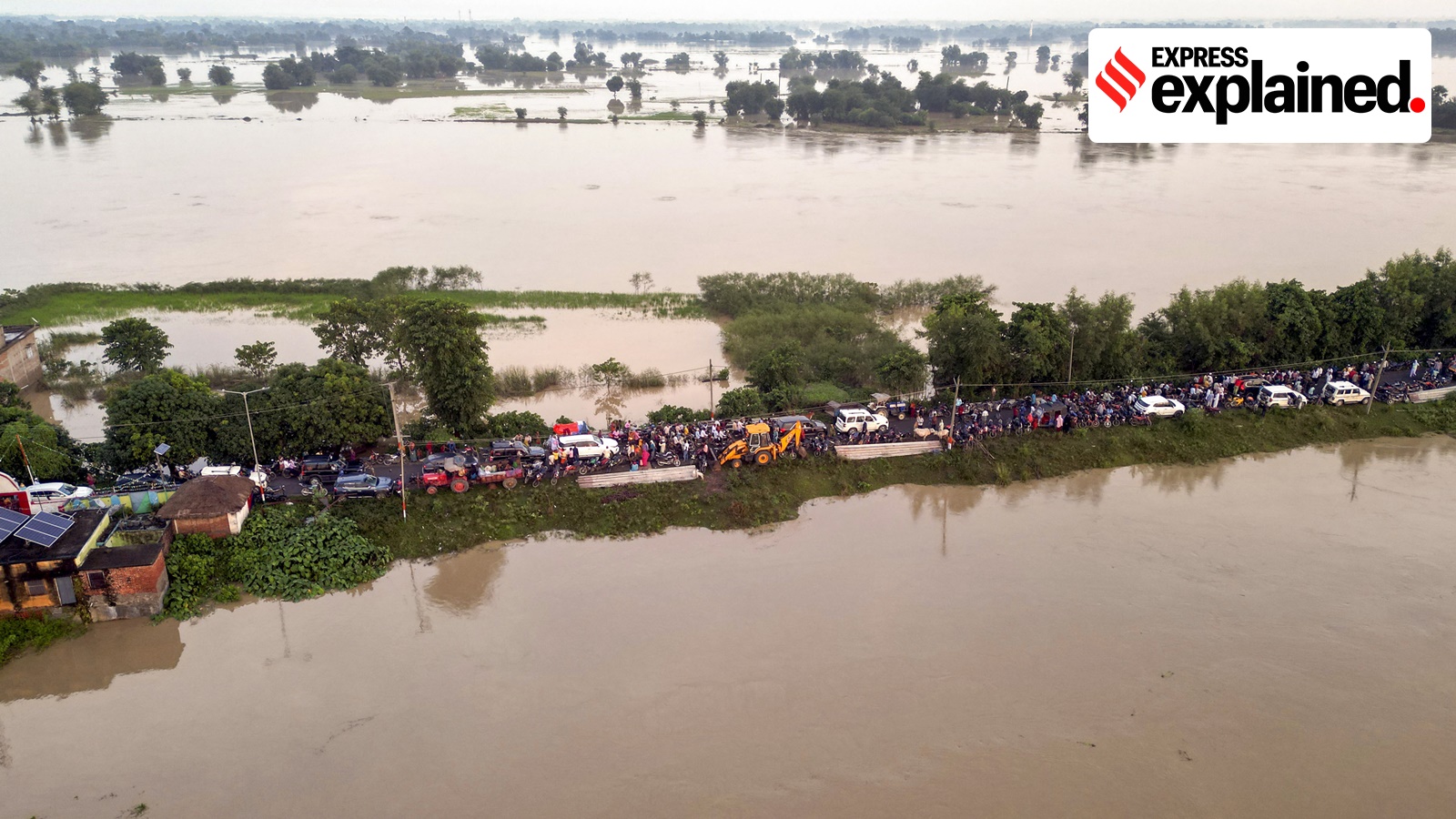 Aerial view of extensive flooding in Bihar with submerged village houses and brown floodwater