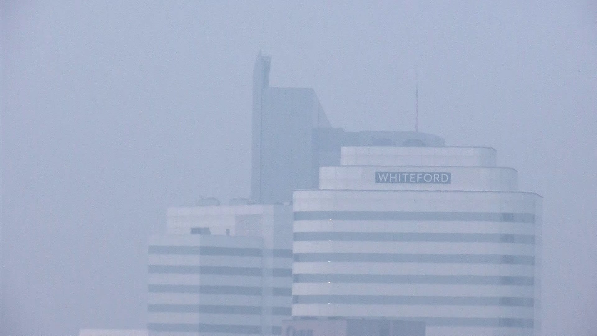 A hazy, smoke-obscured view of the Richmond skyline under Code Purple air quality conditions from Canadian wildfire smoke