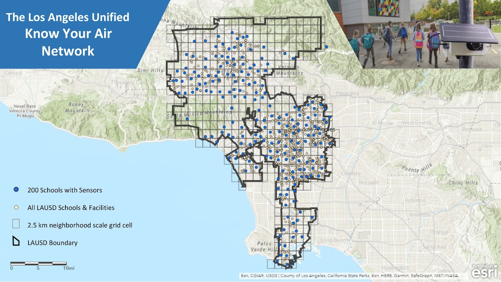 Clarity Node-S air quality sensor installed on a Los Angeles school campus near a playground and classroom buildings